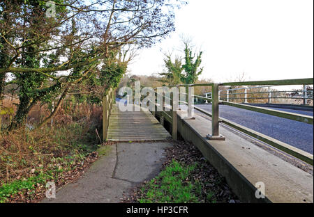 Pedestrian footbridge and A1064 road bridge between Filby Broad and Ormesby Little Broad on the Norfolk Broads at Filby, Norfolk, England, UK. Stock Photo