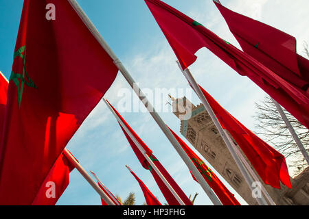 Moroccan flags in Marrakech on a background of blue sky Stock Photo