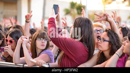 BARCELONA - MAY 23: Girls from the audience in front of the stage, cheering on their idols at the Primavera Pop Festival of Badalona on May 18, 2014 i Stock Photo
