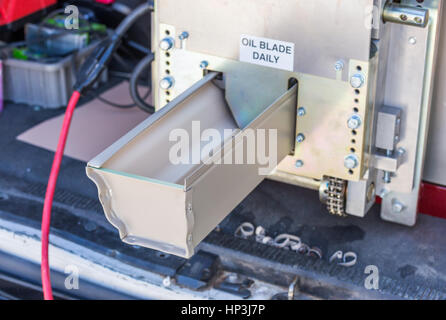 Aluminum Rain Gutter Feeding Through Seamless Shaping Machine. Stock Photo