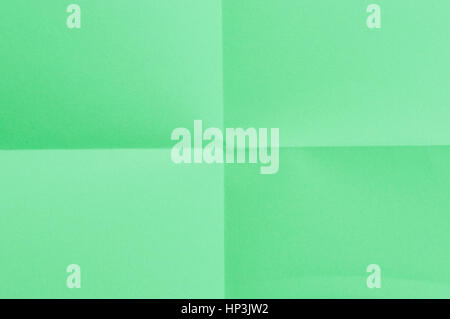 Folded green sheet of paper - close up Stock Photo
