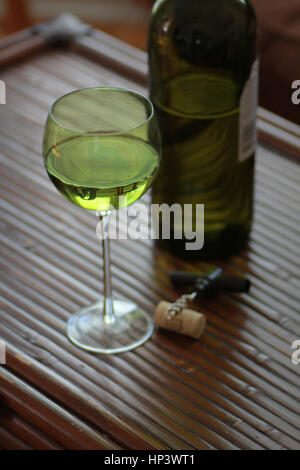 close up of Wine bottle and wine glass on table Stock Photo