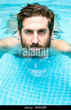 A man in a swimming pool. Stock Photo