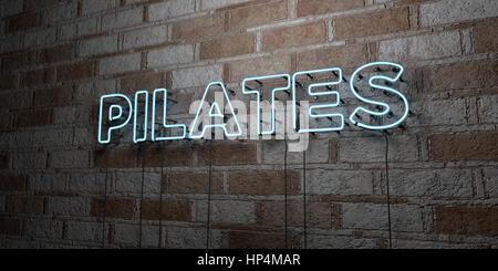 PILATES - Glowing Neon Sign on stonework wall - 3D rendered royalty free stock illustration.  Can be used for online banner ads and direct mailers. Stock Photo