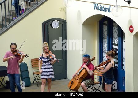 Covent Garden London England, United Kingdom - August 16, 2016: String Quartet busking in convent garden central piazza Stock Photo