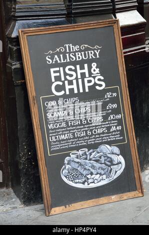 London England, United Kingdom - August 16, 2016: Pub Blackboard sign advertising traditional English Meal of Fish and Chips Stock Photo