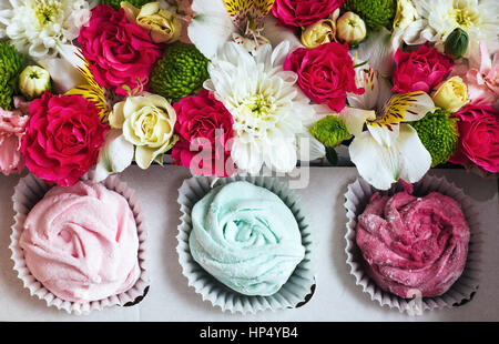 Rose marshmallows and beautiful flowers on a white background wo Stock Photo