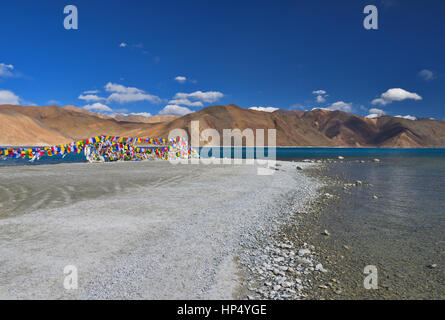 Buddhist prayer flag at the coast of Pangong Lake, ladakh, India Stock Photo