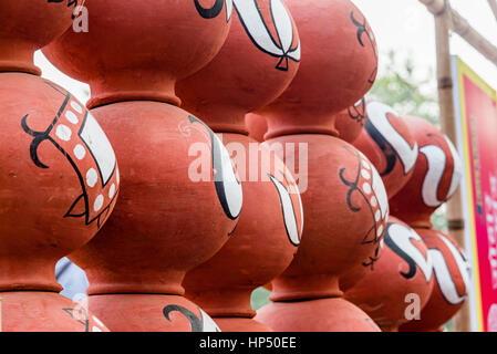 Beautiful bright colour hand made and hand painted pots for display during Suravjkund festival in Faridabad, India. Stock Photo