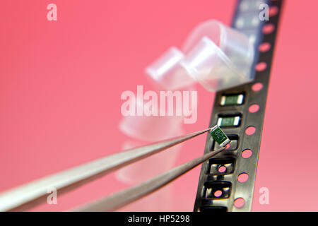 Surface mount components on a carrier tape Stock Photo