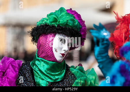 Venice, Italy- February 18th, 2012: Portrait of a person in a traditiona mask during the Venice Carnival days. Stock Photo