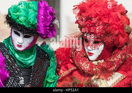 Venice, Italy- February 18th, 2012: Portrait of two person in traditional masks and cotumes during the Venice Carnival days. Stock Photo