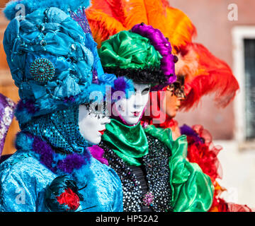 Venice, Italy- February 18th, 2012: Group of persons in traditional masks and cotumes during the Venice Carnival days. Stock Photo