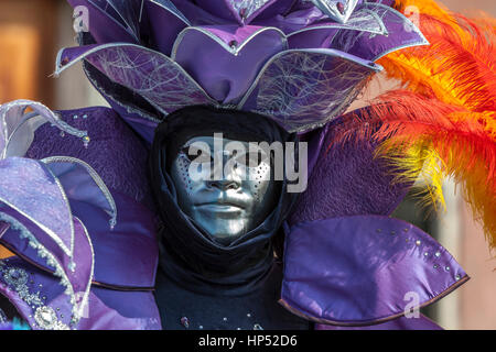 Venice, Italy- February 18th, 2012: Portrait of a person wearing a beautiful mask during the Venice Carnival Stock Photo
