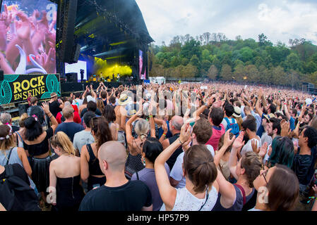 PARIS - AUG 31: Crowd in a concert at Rock En Seine Festival on August 31, 2015 in Paris, France. Stock Photo