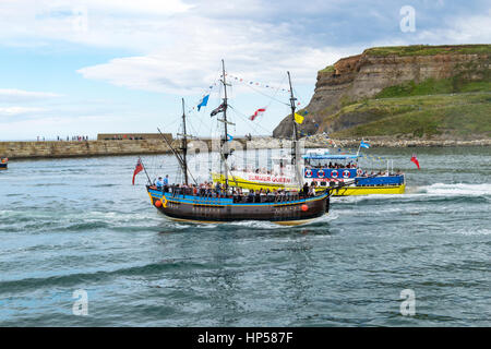 A pirate ship ferry trip around the port of Whitby, Yorkshire, UK Stock Photo