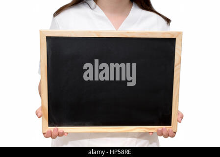 Female nurse holding a blank slate board, isolated on white background. Stock Photo