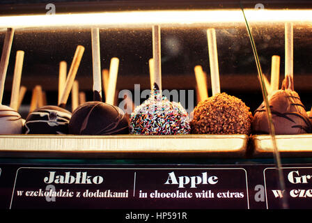 Delicious local street food taffy apple in chocolate with extras, sweets in Zakopane, Poland. Stock Photo