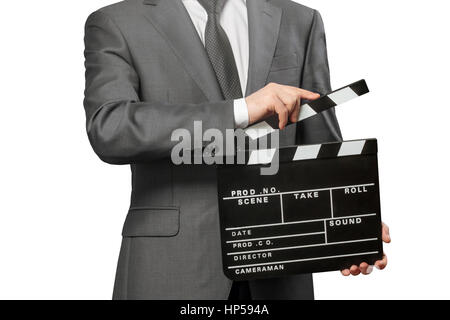 Man holding movie clapper board isolated on white background Stock Photo