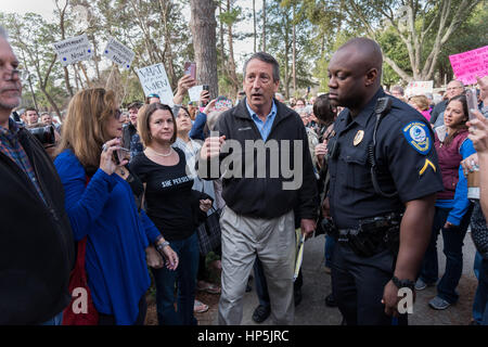 Mount Pleasant, South Carolina, USA. 18th February, 2017. U.S. Rep. Mark Sanford, center, makes his way past constituents after hundreds showed up for a town hall meeting February 18, 2017 in Mount Pleasant, South Carolina. Concerned residents arrived to voice their opposition to President Donald Trump during a vocal meeting. Credit: Planetpix/Alamy Live News Stock Photo
