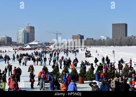 Ottawa, Canada – February 18, 2017:  People celebrate the Winterlude festival on the frozen ice of Dow’s Lake in  Canada’s capital.  Ottawa contains the world’s largest skating rink, on the Rideau Canal. Credit: Paul McKinnon/Alamy Live News Stock Photo