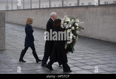 US Vice President Mike Pence (C), his wife Karen Pence (R) and his daughter Charlotte lay a wreath during their visit to the Dachau concentration camp memorial in Dachau, Germany, 19 February 2017. Along with his family, Pence visited the concentration camp memorial in Dachau located north of Munich as he concluded his first official visit to Germany. Photo: Sven Hoppe/dpa Stock Photo