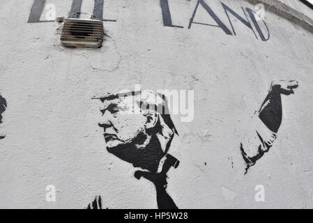 Islington, London, UK. 19th February 2017. New Graffiti by artist Bambi has appeared in Islington portraying the PM Theresa May and US President Donald Trump in a caricature of the movie as  'Lie Lie Land'. Credit: Matthew Chattle/Alamy Live News Stock Photo