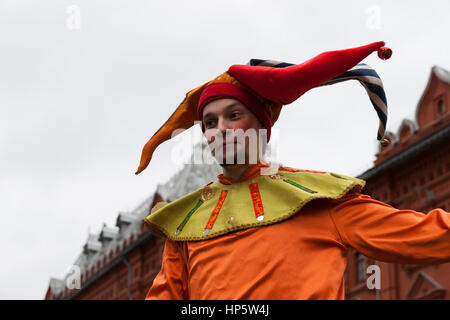 Moscow, Russia. Sunday, Feb. 19, 2017. Maslenitsa, pancake, cheese fare week festival, carnival started in the city. People enjoy street performances and eat hot pancakes. This is also farewell to winter festival. The day is warm (+2C, about 36F) but gloomy. © Alex's Pictures/Alamy Live News Stock Photo