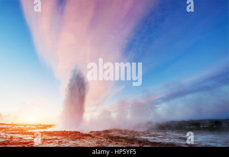 Strokkur geyser eruption in Iceland. Fantastic colors shine thro Stock Photo