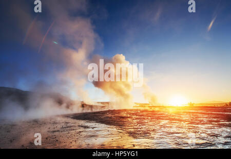 Fantastic sunset Strokkur geyser eruption in Iceland Stock Photo