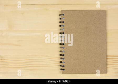 Brown notebook made from recycled on wooden background with copy space Stock Photo