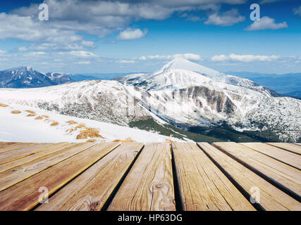 Mysterious winter landscape majestic mountains in  and shabby table . Magical snow covered tree Stock Photo
