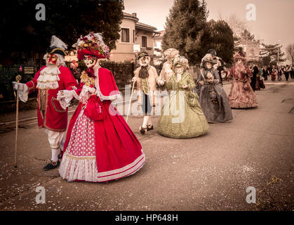 Venice, Italy - February 16, 2017: Carnival Parade with original typical Venetian masks. Stock Photo