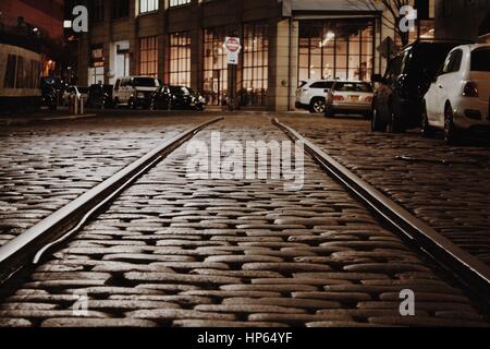 DUMBO, Brooklyn - Tracks Through Cobblestone Street Stock Photo