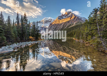 Sunrise and reflection of Mount Edith Cavell in the Rocky Mountains of Jasper National Park, Alberta, Canada Stock Photo