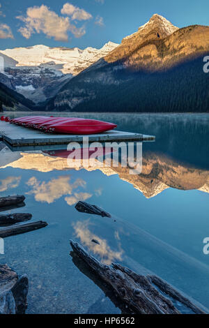 Red canoes on the dock at lake Louise in Banff National Park, Alberta, Canada. Stock Photo