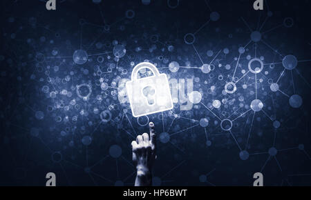 Lock glowing icon pressed with finger on dark background Stock Photo