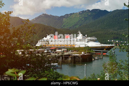 Cruise ship in Alaska port on day. Tourism on cruise line to alaska mountain Stock Photo