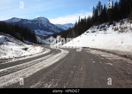 Dirt road across mountains in Kananaskis Country Stock Photo