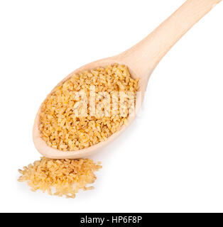 Bulgur or couscous or cous in wooden spoon isolated on white background Stock Photo