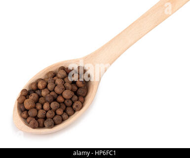 pimento peppercorns in wooden spoon isolated on white background. Whole allspice berries in wooden spoon. Myrtle pepper. Jamaica pepper. Spice of pepp Stock Photo