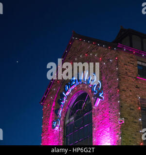 Camden Lock Market sign at night, the striking pin point of light in the night sky is the planet Venus just after sunset Stock Photo