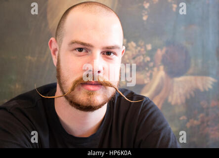 Portrait of a young man with handlebar moustache in Napier, New Zealand. Stock Photo