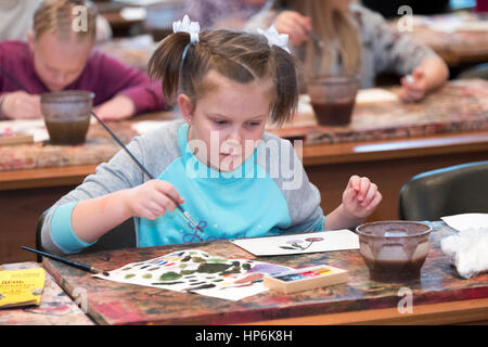 Moscow, Russia - February 18, 2017: Children aged 6-9 years attend free drawing workshop during the open day in watercolors school Stock Photo