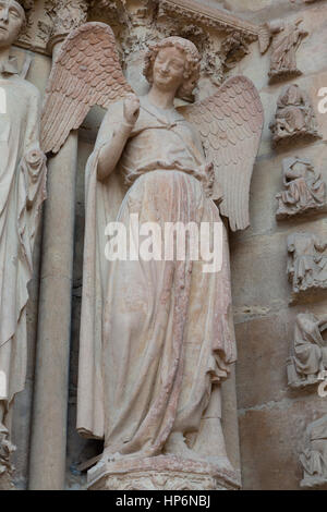 The 'Smiling Angel' is a stone sculpture of the cathedral of Reims, France. Stock Photo