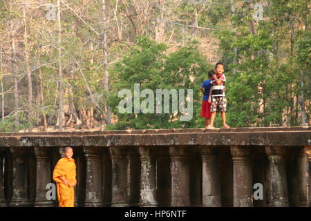 Young child monk walking in Angkor Wat Cambodia Stock Photo