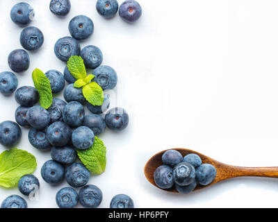 Blueberries isolated on white background. Blueberry border design. Ripe and juicy fresh picked bilberries close up. Copyspace. Top view or flat lay Stock Photo