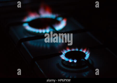 Flames of gas burners on stove Stock Photo