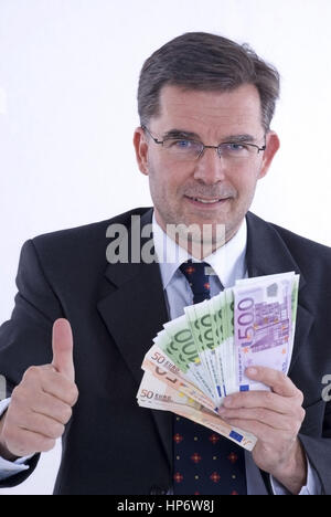 Model released , Geschaeftsmann mit Geld - business man with money Stock Photo