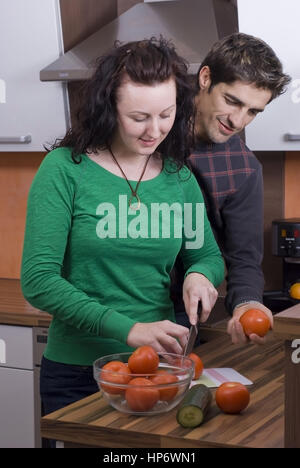 Model released , Paar beim gemeinsamen Kochen in der Kueche - couple cooking together Stock Photo